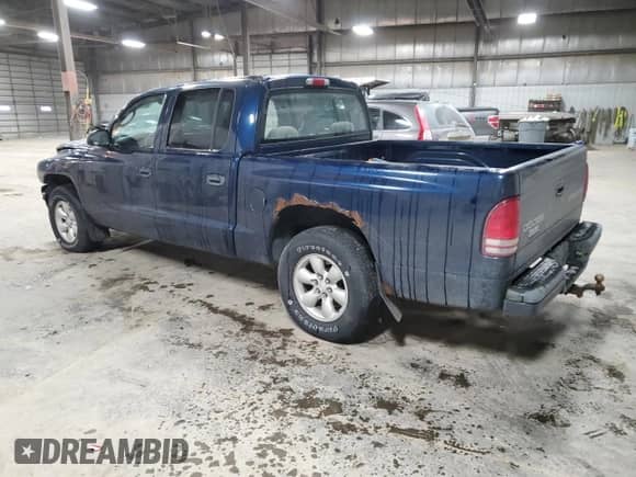 2004 Dodge Dakota Sport z VIN 1D7HL38NX4S579042, wystawiony jako Copart lot #85283564 z przebiegiem 327 981 mil mil oraz Szkoda całkowita • Salvage title. Historia ofert i sprzedaży dostępna na DreamBid. Obrazek 2.