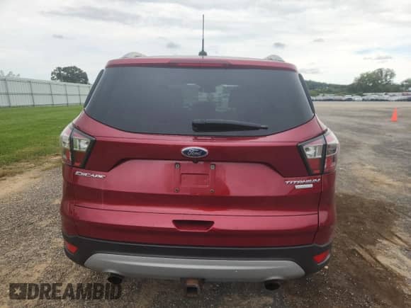 2017 Ford Escape Titanium с VIN 1FMCU0J95HUA77073, выставлен на аукционе Copart как лот 70429605 с пробегом 55 737 миль миль и На запчасти • Non repairable. История ставок и продаж доступна на DreamBid. Изображение 6.