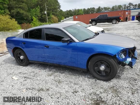 2022 Dodge Charger Police with VIN 2C3CDXAT5NH116675, listed as a Copart auction lot 55891205 with 59,669 mi miles and Salvage title. Bid and sale history available at DreamBid. Image 4.