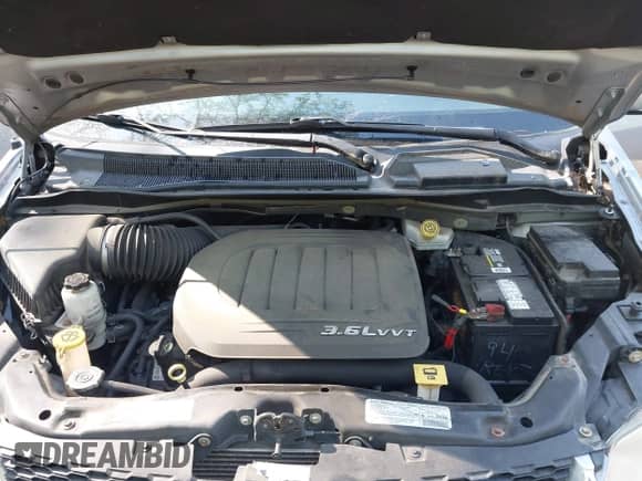 2013 Dodge Grand Caravan Crew z VIN 2C4RDGDG8DR659242, wystawiony jako IAAI lot #42557248 z przebiegiem 165 305 mil mil oraz . Historia ofert i sprzedaży dostępna na DreamBid. Obrazek 10.