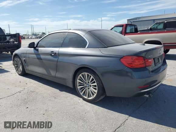 2015 BMW 4 Series 428i with VIN WBA3V7C54FP771900, listed as a Copart auction lot 66550815 with 104,367 mi miles and Salvage title. Bid and sale history available at DreamBid. Image 2.