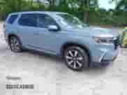 2025 Honda Pilot Touring with VIN 5FNYG2H70SB011614, listed as a IAAI auction lot 42205848 with 37,719 mi miles and . Bid and sale history available at DreamBid. Image 1.