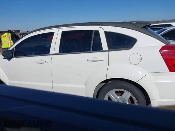 2009 Dodge Caliber SXT with VIN 1B3HB48C29D181709, listed as a IAAI auction lot 41425090 with 147,557 mi miles and . Bid and sale history available at DreamBid. Image 14.