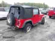 2002 Jeep Wrangler Sport z VIN 1J4FA49S92P715110, wystawiony jako IAAI lot #43455131 z przebiegiem 153 258 mil mil oraz . Historia ofert i sprzedaży dostępna na DreamBid. Obrazek 4.