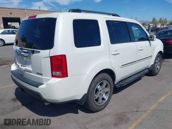 2011 Honda Pilot Touring with VIN 5FNYF3H98BB034357, listed as a IAAI auction lot 42939634 with 116,346 mi miles and . Bid and sale history available at DreamBid. Image 4.