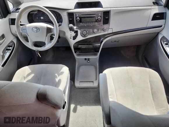 2012 Toyota Sienna with VIN 5TDZK3DCXCS233781, listed as a Copart auction lot 82167325 with 183,332 mi miles and Salvage title. Bid and sale history available at DreamBid. Image 8.