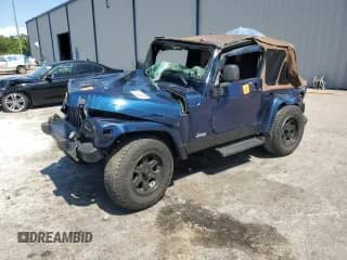 2003 Jeep Wrangler X z VIN 1J4FA39S43P357281, wystawiony jako Copart lot #67979335 z przebiegiem Nie podano mil oraz Szkoda całkowita • Salvage title. Historia ofert i sprzedaży dostępna na DreamBid. Obrazek 1.