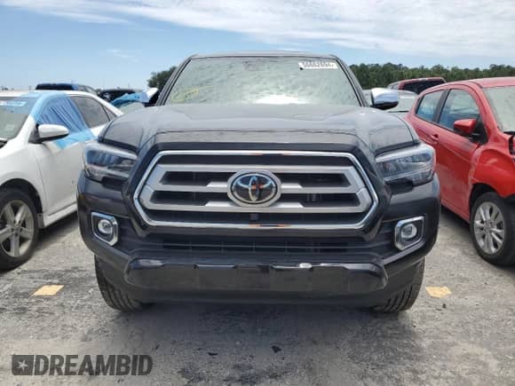 2023 Toyota Tacoma Limited с VIN 3TMEZ5CN1PM218536, выставлен на аукционе Copart как лот 56662694 с пробегом 10 217 миль миль и Списание • Salvage title. История ставок и продаж доступна на DreamBid. Изображение 5.