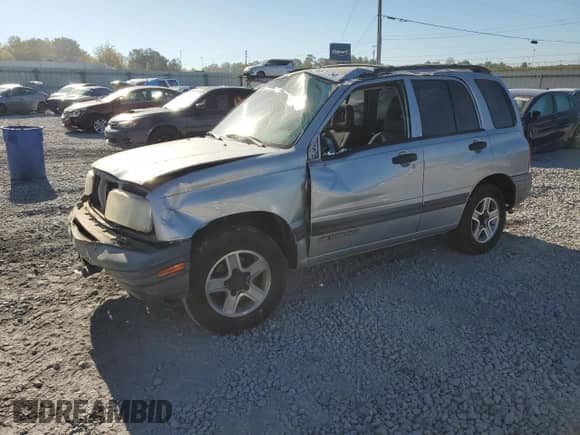 2003 Chevrolet Tracker z VIN 2CNBE13C636908563, wystawiony jako Copart lot #76871754 z przebiegiem 205 684 mil mil oraz Szkoda całkowita • Salvage title. Historia ofert i sprzedaży dostępna na DreamBid. Obrazek 1.