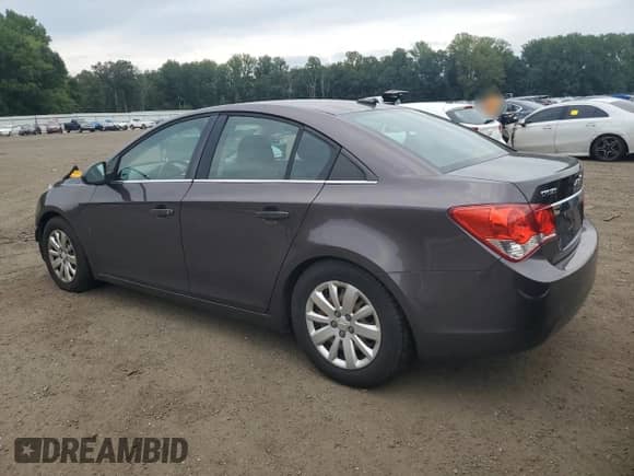 2011 Chevrolet Cruze 1LT z VIN 1G1PF5S9XB7111289, wystawiony jako Copart lot #66905785 z przebiegiem 107 249 mil mil oraz Szkoda całkowita • Salvage title. Historia ofert i sprzedaży dostępna na DreamBid. Obrazek 2.
