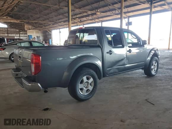 2007 Nissan Frontier SE with VIN 1N6AD07U67C431739, listed as a Copart auction lot 86591175 with 131,668 mi miles and Salvage title. Bid and sale history available at DreamBid. Image 3.