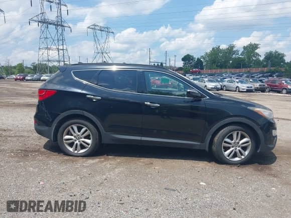 2014 Hyundai Santa Fe with VIN 5XYZWDLA0EG189400, listed as a IAAI auction lot 42391658 with 51,911 mi miles and . Bid and sale history available at DreamBid. Image 13.