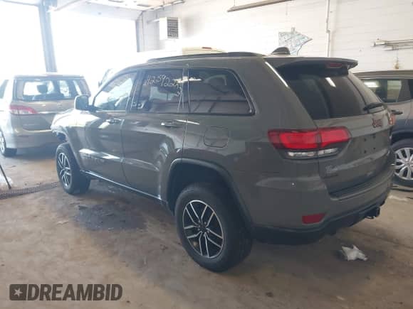 2020 Jeep Grand Cherokee Trailhawk with VIN 1C4RJFLG6LC101899, listed as a IAAI auction lot 42592283 with 116,619 mi miles and . Bid and sale history available at DreamBid. Image 3.