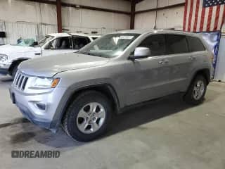 2014 Jeep Grand Cherokee Laredo z VIN 1C4RJEAG5EC255973, wystawiony jako Copart lot #71548195 z przebiegiem 106 040 mil mil oraz Czysty tytuł • Clean title. Historia ofert i sprzedaży dostępna na DreamBid. Obrazek 1.