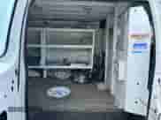 2014 Ford Econoline Cargo Commercial with VIN 1FTNE2EL0EDA59328, listed as a Copart auction lot 60909645 with 128,825 mi miles and Clean title. Bid and sale history available at DreamBid. Image 6.