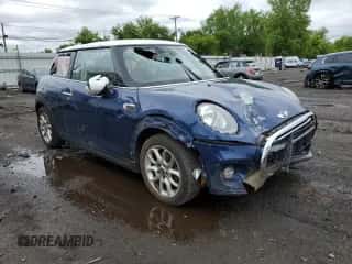 2016 MINI Hardtop with VIN WMWXP5C58G3B76219, listed as a Copart auction lot 57879225 with 94,245 mi miles and Salvage title. Bid and sale history available at DreamBid. Image 4.