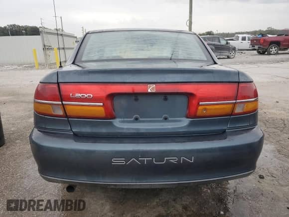 2002 Saturn LS with VIN 1G8JU54F72Y581967, listed as a Copart auction lot 74521994 with 215,018 mi miles and Salvage title. Bid and sale history available at DreamBid. Image 6.