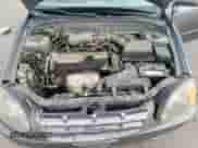 2004 Hyundai Accent GL z VIN KMHCG35C34U290855, wystawiony jako Copart lot #70719664 z przebiegiem 176 210 mil mil oraz Szkoda całkowita • Salvage title. Historia ofert i sprzedaży dostępna na DreamBid. Obrazek 11.