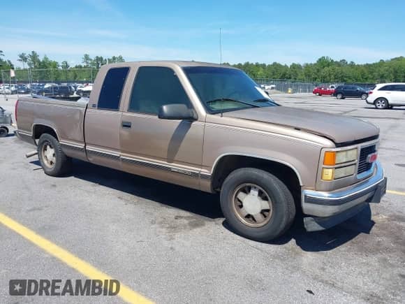 1996 GMC Sierra 1500 z VIN 2GTEC19M3T1502695, wystawiony jako IAAI lot #42199919 z przebiegiem 285 889 mil mil oraz . Historia ofert i sprzedaży dostępna na DreamBid. Obrazek 1.