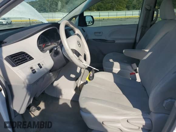 2012 Toyota Sienna with VIN 5TDZK3DC2CS184186, listed as a Copart auction lot 71013535 with 172,772 mi miles and Salvage title. Bid and sale history available at DreamBid. Image 7.