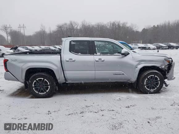 2024 Toyota Tacoma SR5 with VIN 3TMLB5JN6RM018639, listed as a IAAI auction lot 41251861 with 10,088 mi miles and . Bid and sale history available at DreamBid. Image 13.