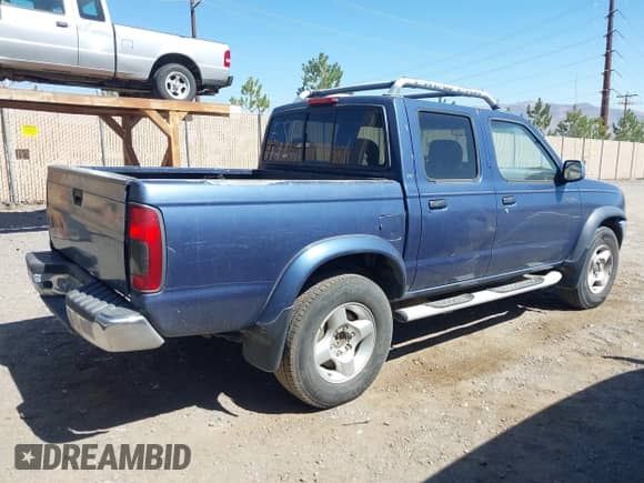 2000 Nissan Frontier XE with VIN 1N6ED27TXYC378601, listed as a IAAI auction lot 42690648 with 216,829 mi miles and . Bid and sale history available at DreamBid. Image 4.