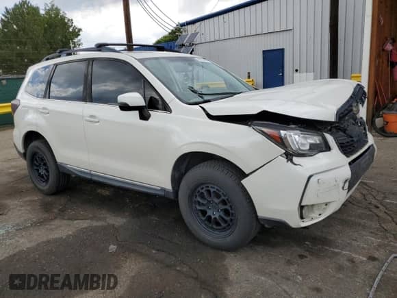 2017 Subaru Forester Touring z VIN JF2SJGTC9HH412677, wystawiony jako Copart lot #68206405 z przebiegiem 130 892 mil mil oraz Szkoda całkowita • Salvage title. Historia ofert i sprzedaży dostępna na DreamBid. Obrazek 4.
