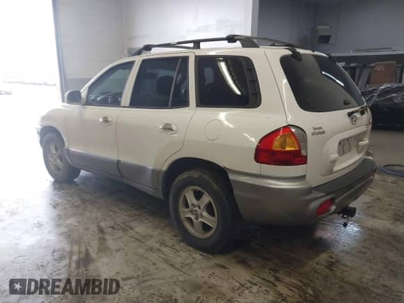 2004 Hyundai Santa Fe GLS with VIN KM8SC13E44U797943, listed as a IAAI auction lot 41731356 with 184,139 mi miles and . Bid and sale history available at DreamBid. Image 3.