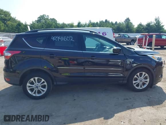 2018 Ford Escape SE with VIN 1FMCU9GD8JUC47268, listed as a IAAI auction lot 42941602 with 87,617 mi miles and . Bid and sale history available at DreamBid. Image 13.