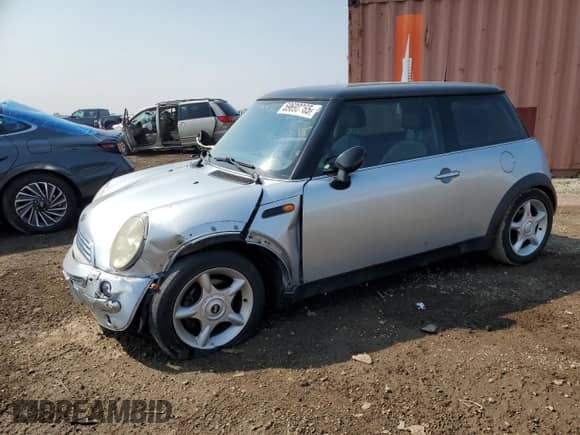 2004 MINI Hardtop with VIN WMWRC33454TJ56308, listed as a Copart auction lot 59690865 with 99,374 mi miles and Salvage title. Bid and sale history available at DreamBid. Image 1.