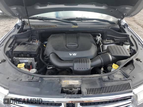 2015 Dodge Durango SXT with VIN 1C4RDJAG2FC850636, listed as a Copart auction lot 69683265 with 143,302 mi miles and Salvage title. Bid and sale history available at DreamBid. Image 12.