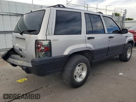 1995 Jeep Grand Cherokee Laredo with VIN 1J4GZ58S2SC703196, listed as a Copart auction lot 68571944 with 264,876 mi miles and Clean title. Bid and sale history available at DreamBid. Image 3.