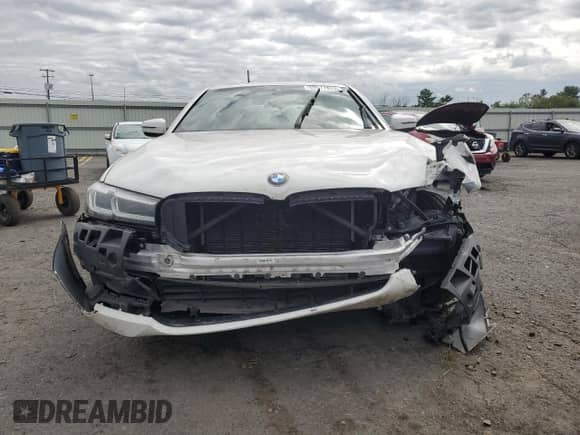 2022 BMW 5 Series 540i xDrive z VIN WBA73BJ01NWX52548, wystawiony jako Copart lot #69517675 z przebiegiem 56 665 mil mil oraz Szkoda całkowita • Salvage title. Historia ofert i sprzedaży dostępna na DreamBid. Obrazek 5.