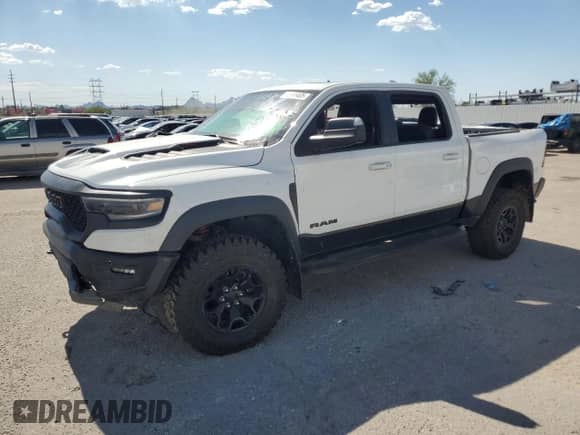 2022 Ram 1500 TRX z VIN 1C6SRFU99NN102201, wystawiony jako Copart lot #69654795 z przebiegiem Nie podano mil oraz Czysty tytuł • Clean title. Historia ofert i sprzedaży dostępna na DreamBid. Obrazek 1.