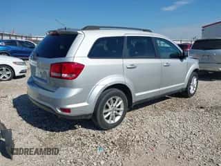2014 Dodge Journey SXT with VIN 3C4PDCBB3ET112742, listed as a IAAI auction lot 43420445 with 113,538 mi miles and . Bid and sale history available at DreamBid. Image 4.