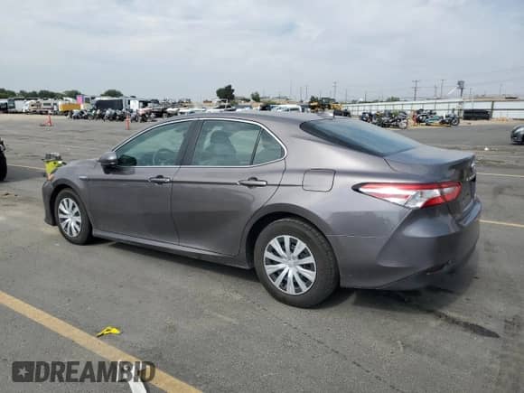 2019 Toyota Camry Hybrid LE с VIN 4T1B31HK3KU006667, выставлен на аукционе Copart как лот 80162455 с пробегом 81 491 миль миль и Списание • Salvage title. История ставок и продаж доступна на DreamBid. Изображение 2.
