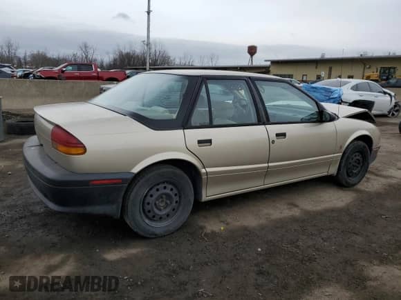 1994 Saturn SL with VIN 1G8ZH5593RZ290970, listed as a Copart auction lot 48029235 with 116,730 mi miles and Salvage title. Bid and sale history available at DreamBid. Image 3.