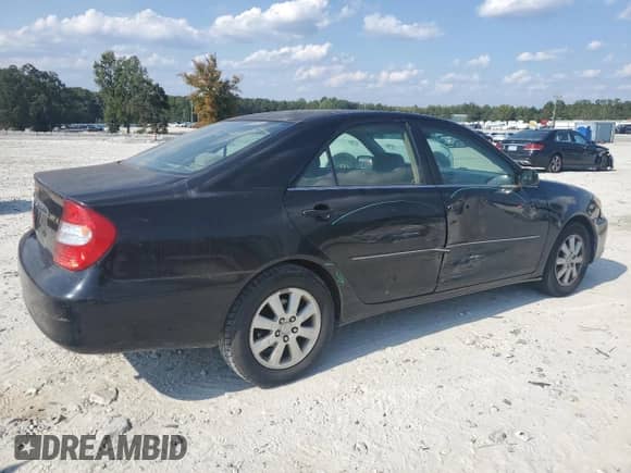 2003 Toyota Camry XLE с VIN 4T1BE30K33U181715, выставлен на аукционе Copart как лот 71077945 с пробегом 233 892 миль миль и Списание • Salvage title. История ставок и продаж доступна на DreamBid. Изображение 3.