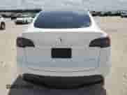 2023 Tesla Model Y Long Range с VIN 7SAYGDEE7PA112705, выставлен на аукционе Copart как лот 65862094 с пробегом 18 066 миль миль и Списание • Salvage title. История ставок и продаж доступна на DreamBid. Изображение 6.