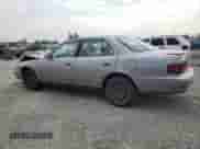 1996 Toyota Camry DX z VIN JT2BG12K9T0371115, wystawiony jako Copart lot #70061945 z przebiegiem 274 613 mil mil oraz Szkoda całkowita • Salvage title. Historia ofert i sprzedaży dostępna na DreamBid. Obrazek 2.