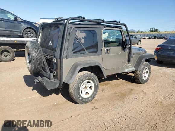 2004 Jeep Wrangler Sport z VIN 1J4FA49S24P710365, wystawiony jako Copart lot #68557195 z przebiegiem 242 901 mil mil oraz Szkoda całkowita • Salvage title. Historia ofert i sprzedaży dostępna na DreamBid. Obrazek 3.