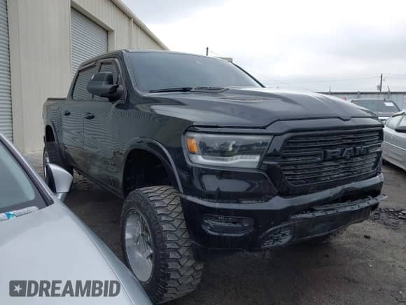 2021 Ram 1500 Laramie with VIN 1C6RREJTXMN629722, listed as a IAAI auction lot 41285829 with 59,638 mi miles and . Bid and sale history available at DreamBid. Image 1.