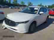2024 Mazda CX-5 S Select z VIN JM3KFBBL7R0444359, wystawiony jako IAAI lot #43049680 z przebiegiem 27 456 mil mil oraz . Historia ofert i sprzedaży dostępna na DreamBid. Obrazek 2.