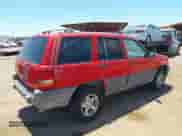 1996 Jeep Grand Cherokee Laredo z VIN 1J4GZ58Y5TC183677, wystawiony jako IAAI lot #42582989 z przebiegiem 187 453 mil mil oraz . Historia ofert i sprzedaży dostępna na DreamBid. Obrazek 4.