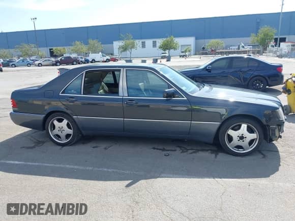 1993 Mercedes-Benz 500 with VIN WDBGA51E5PA138123, listed as a IAAI auction lot 42012923 with 141,594 mi miles and . Bid and sale history available at DreamBid. Image 14.