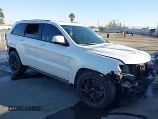 2017 Jeep Grand Cherokee SRT z VIN 1C4RJFDJ7HC600227, wystawiony jako IAAI lot #41390600 z przebiegiem 96 841 mil mil oraz . Historia ofert i sprzedaży dostępna na DreamBid. Obrazek 1.