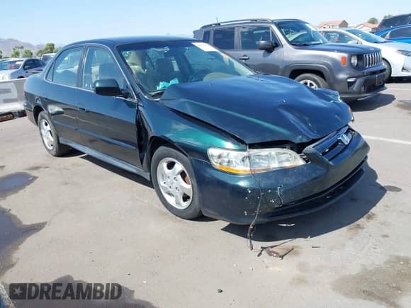 2001 Honda Accord LX with VIN JHMCG665X1C004411, listed as a IAAI auction lot 42653879 with 200,554 mi miles and . Bid and sale history available at DreamBid. Image 1.
