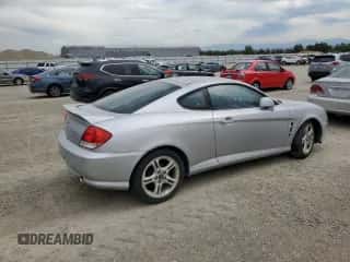 2005 Hyundai Tiburon GT with VIN KMHHN65F45U174430, listed as a Copart auction lot 70741785 with Not provided miles and Non repairable. Bid and sale history available at DreamBid. Image 3.