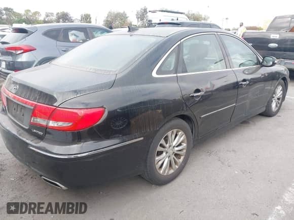 2011 Hyundai Azera Limited z VIN KMHFC4DF6BA552635, wystawiony jako IAAI lot #42816840 z przebiegiem 235 378 mil mil oraz . Historia ofert i sprzedaży dostępna na DreamBid. Obrazek 4.