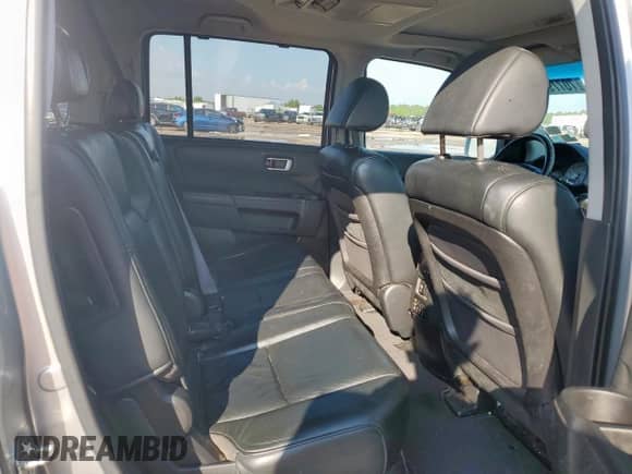 2011 Honda Pilot Touring z VIN 5FNYF3H97BB017646, wystawiony jako Copart lot #70779255 z przebiegiem 219 787 mil mil oraz Czysty tytuł • Clean title. Historia ofert i sprzedaży dostępna na DreamBid. Obrazek 11.